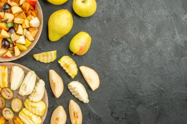 Top view of fruity salad with fresh sliced fruits