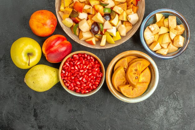 Top view of fruity salad with fresh sliced fruits