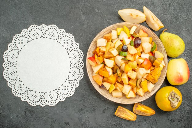 Top view of fruity salad with fresh sliced fruits