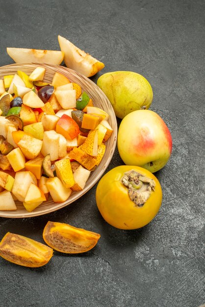 Top view of fruity salad with fresh sliced fruits