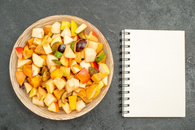 Top view of fruity salad with fresh sliced fruits