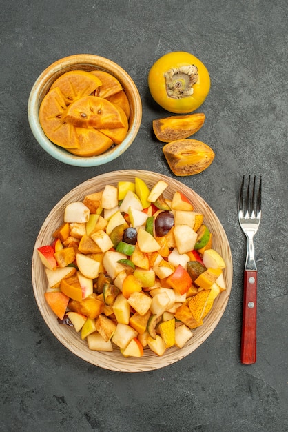 Top view of fruity salad with fresh sliced fruits