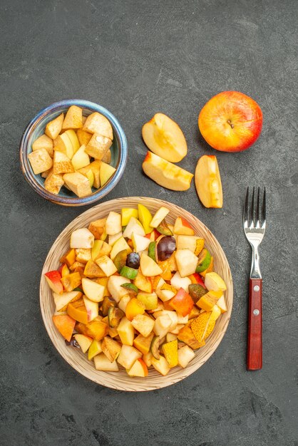 Top view of fruity salad with fresh sliced fruits