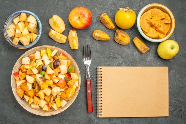 Top view of fruity salad with fresh sliced fruits