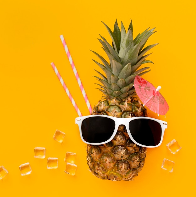 Top view funny pineapple with sunglasses