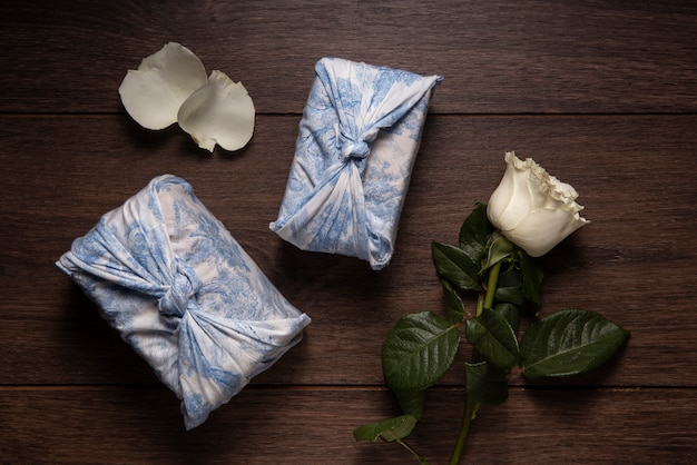 Free photo top view furoshiki package and flower