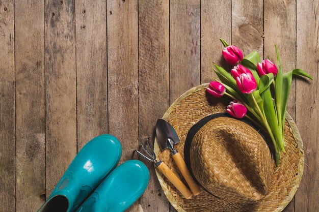 Top view of gardening items and tulips