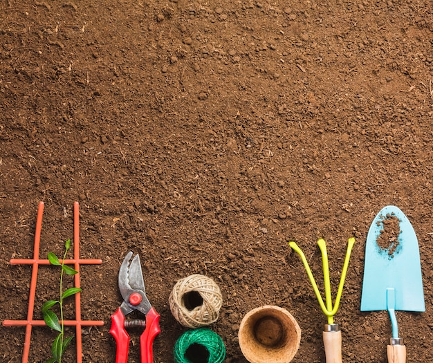 Top view of gardening tools on the ground