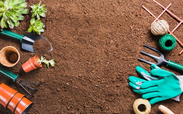 Top view of gardening tools on the ground