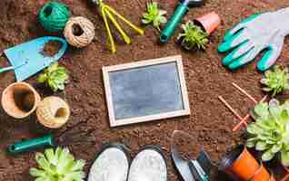 Free photo top view of gardening tools on the ground