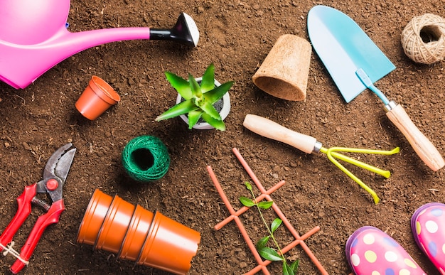 Top view of gardening tools on the ground