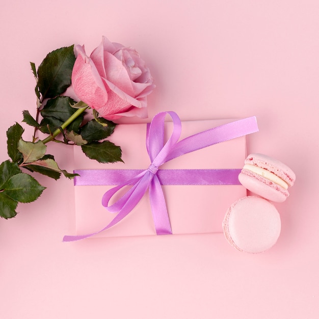 Top view of gift with ribbon and macarons