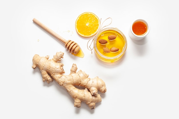 Free photo top view ginger with honey stick