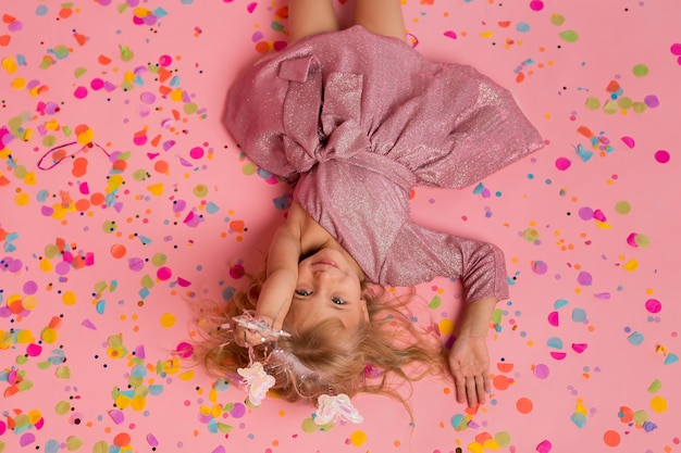 Top view of girl in fairy costume with confetti