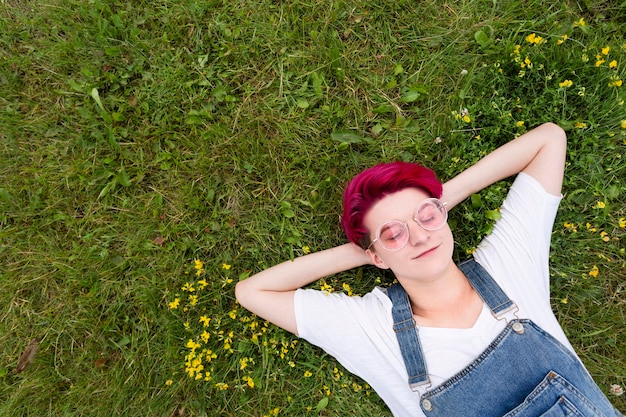 Top view girl laying on grass