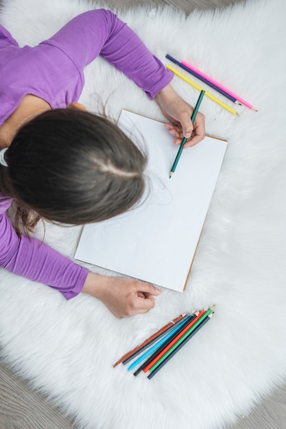 Top view of girl painting