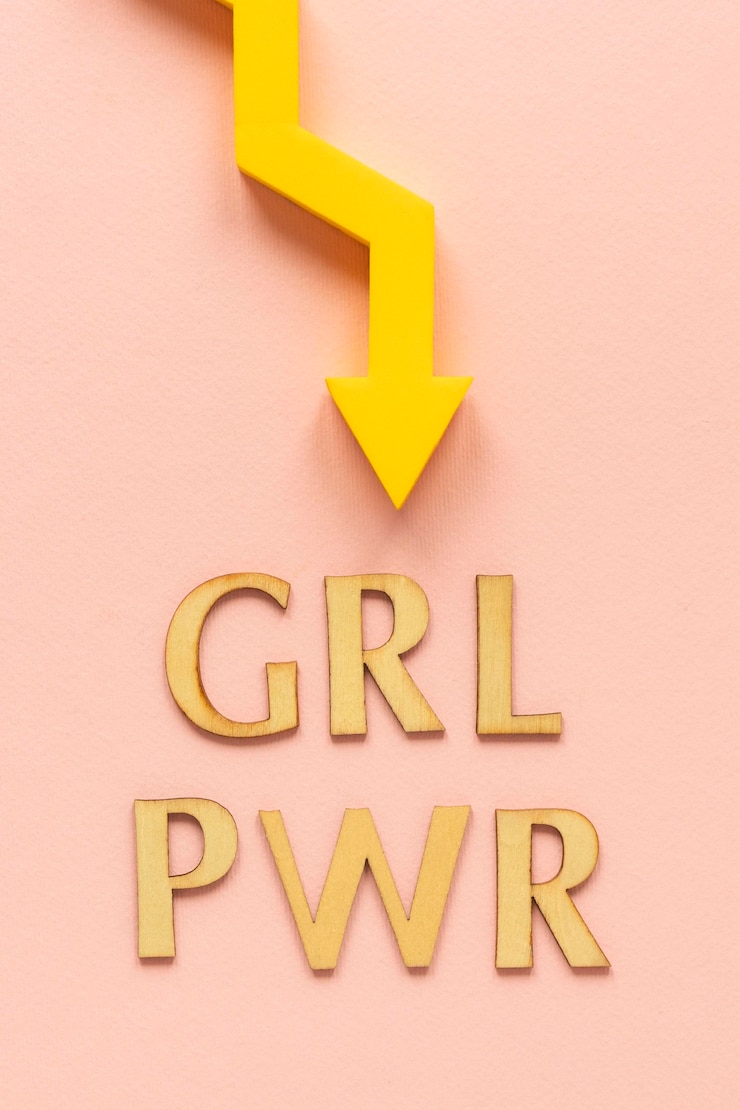 Free Photo top view of girl power with arrow for women's day