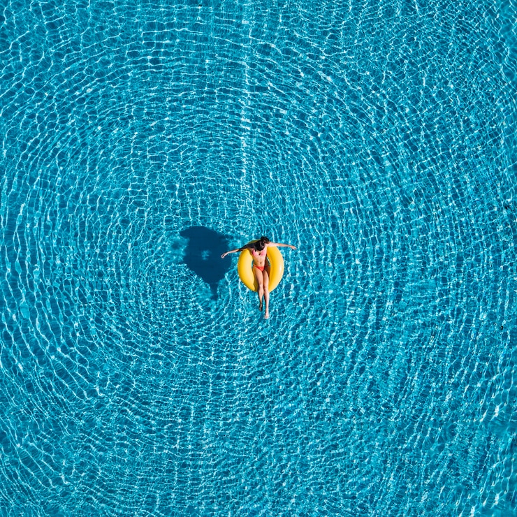 Free Photo top view of girl relaxing on inflatable ring