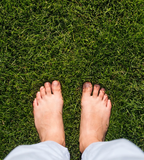 Top view girl standing on grass