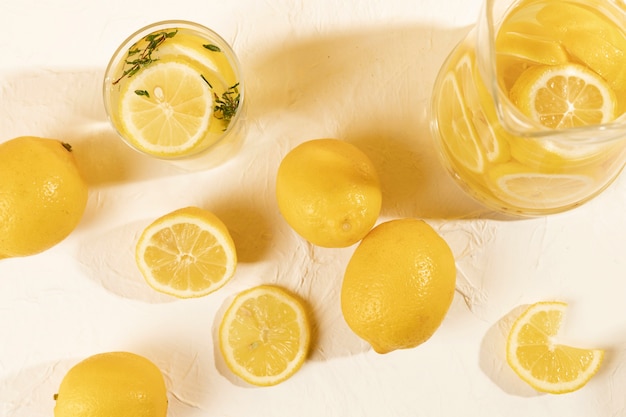 Top view glass with lemon on table