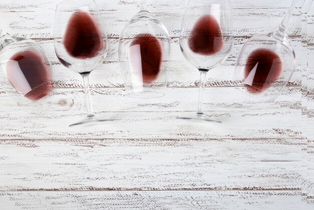 Top view glasses laying on table with red wine