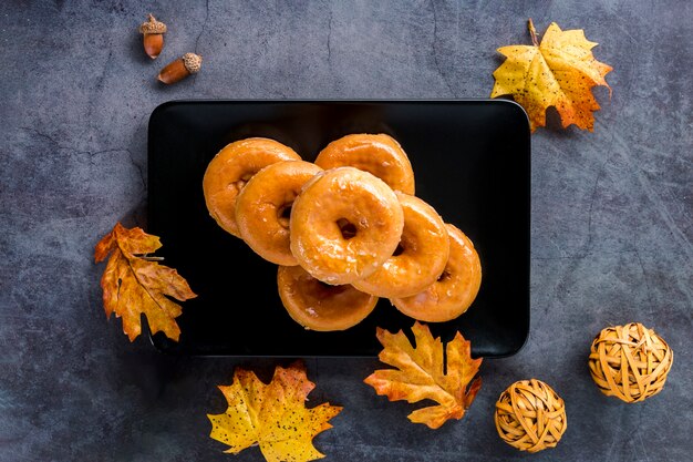 Top view glazed donuts on plate