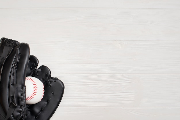 Top view of glove with baseball and copy space