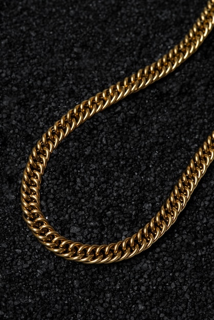 Top view gold chain on dark background