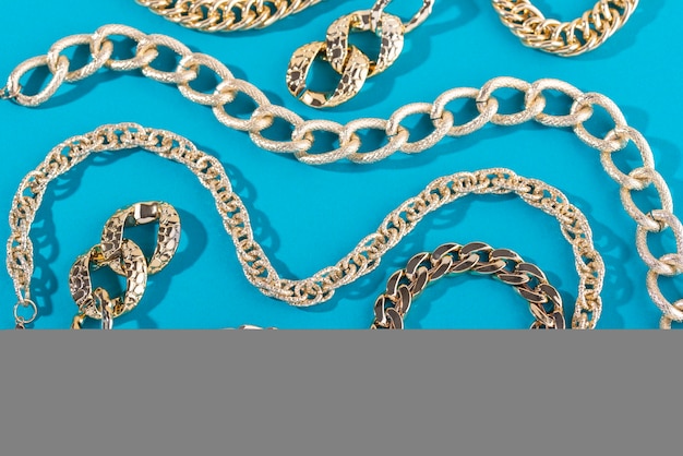 Top view on gold chains still life