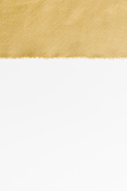 Free photo top view golden fabric with copy space