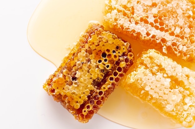 Top view golden honeycombs on honey