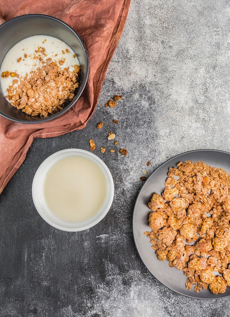 Top view granola with organic milk on the table