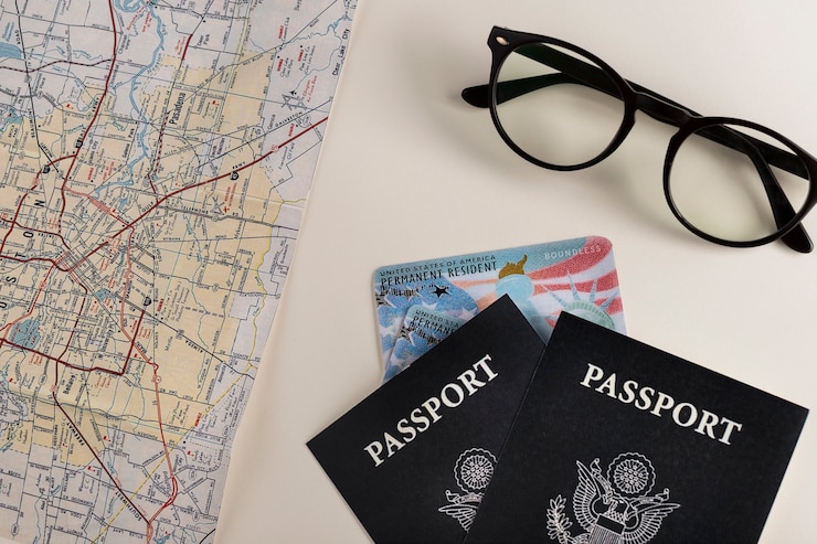 Free Photo top view green card and passports assortment