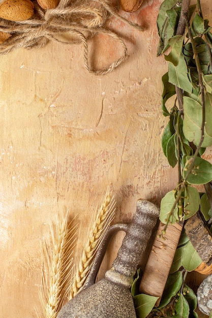 Top view of green leaves with ropes on wooden desk