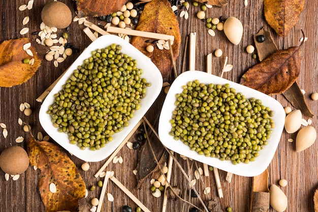 Top view of green lentils on a plank