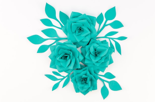 Top view green paper flowers on white background