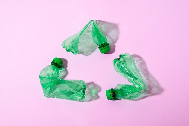 Top view green plastic bottles arrangement