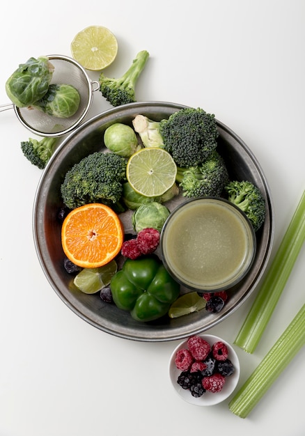 Free photo top view green smoothie arrangement