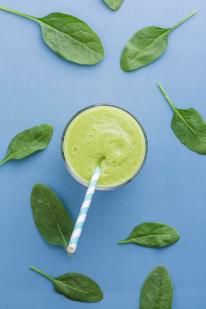 Top view green smoothie with leaves