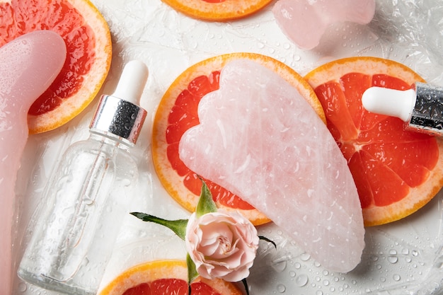 Top view gua sha and grapefruit assortment