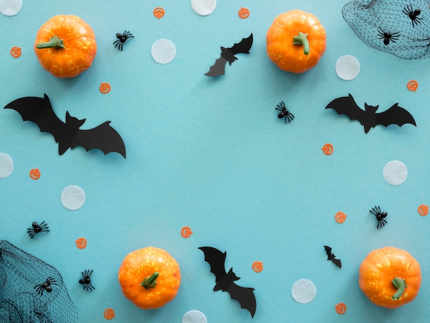 Top view halloween concept with pumpkins
