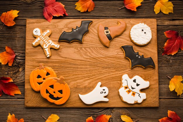 Top view halloween cookies on a wooden board