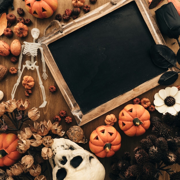 Free photo top view halloween decoration with slate