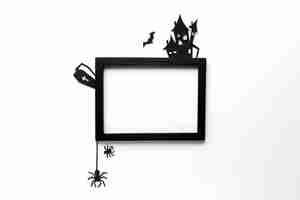 Free photo top view halloween elements with frame