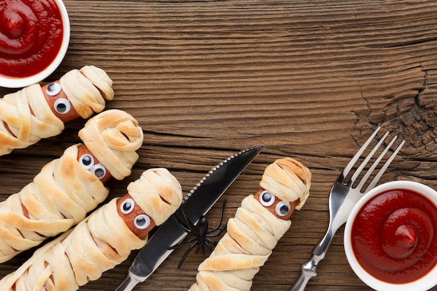 Top view halloween food ketchup and cutlery