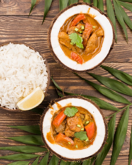 Top view halves of coconut and stew