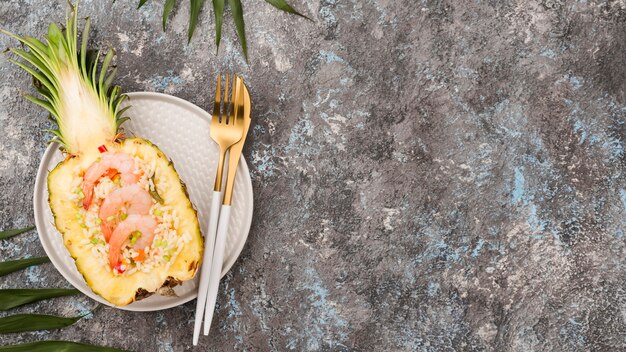 Top view halves of pineapple with shrimps