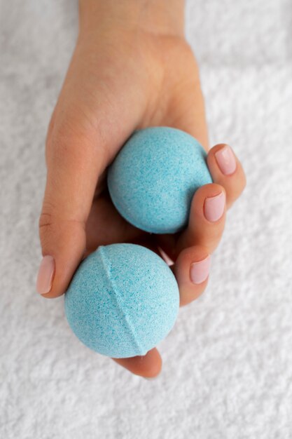 Top view hand holding bath bombs