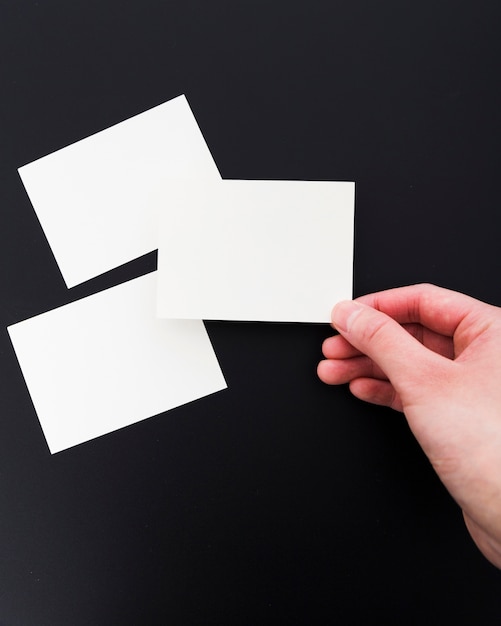 Top view hand holding blank business card