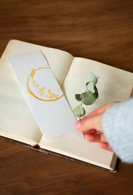 Top view hand holding bookmark